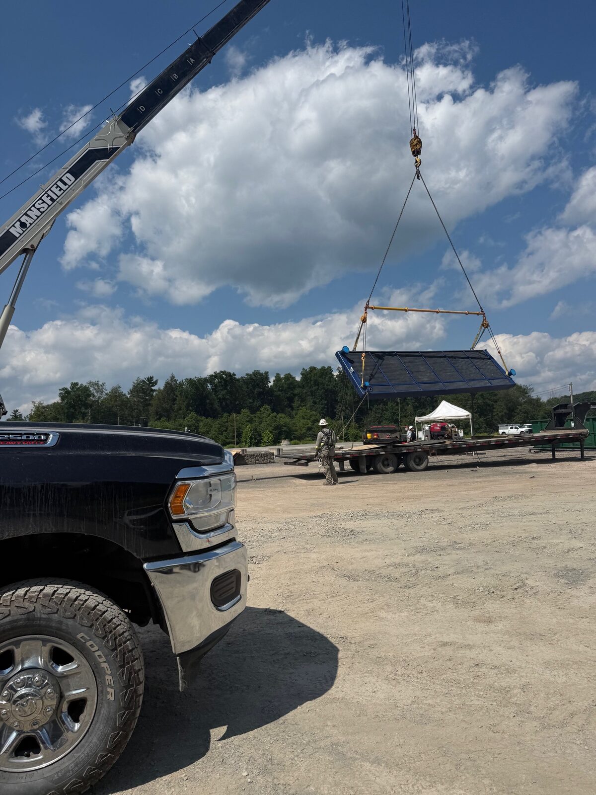 Compressor cooler unit being lifted by crane for replacement
